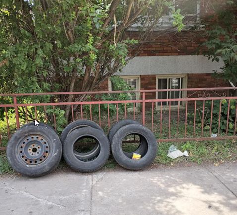 Tires on the sidewalk - Par-Ex Turning into a Slum